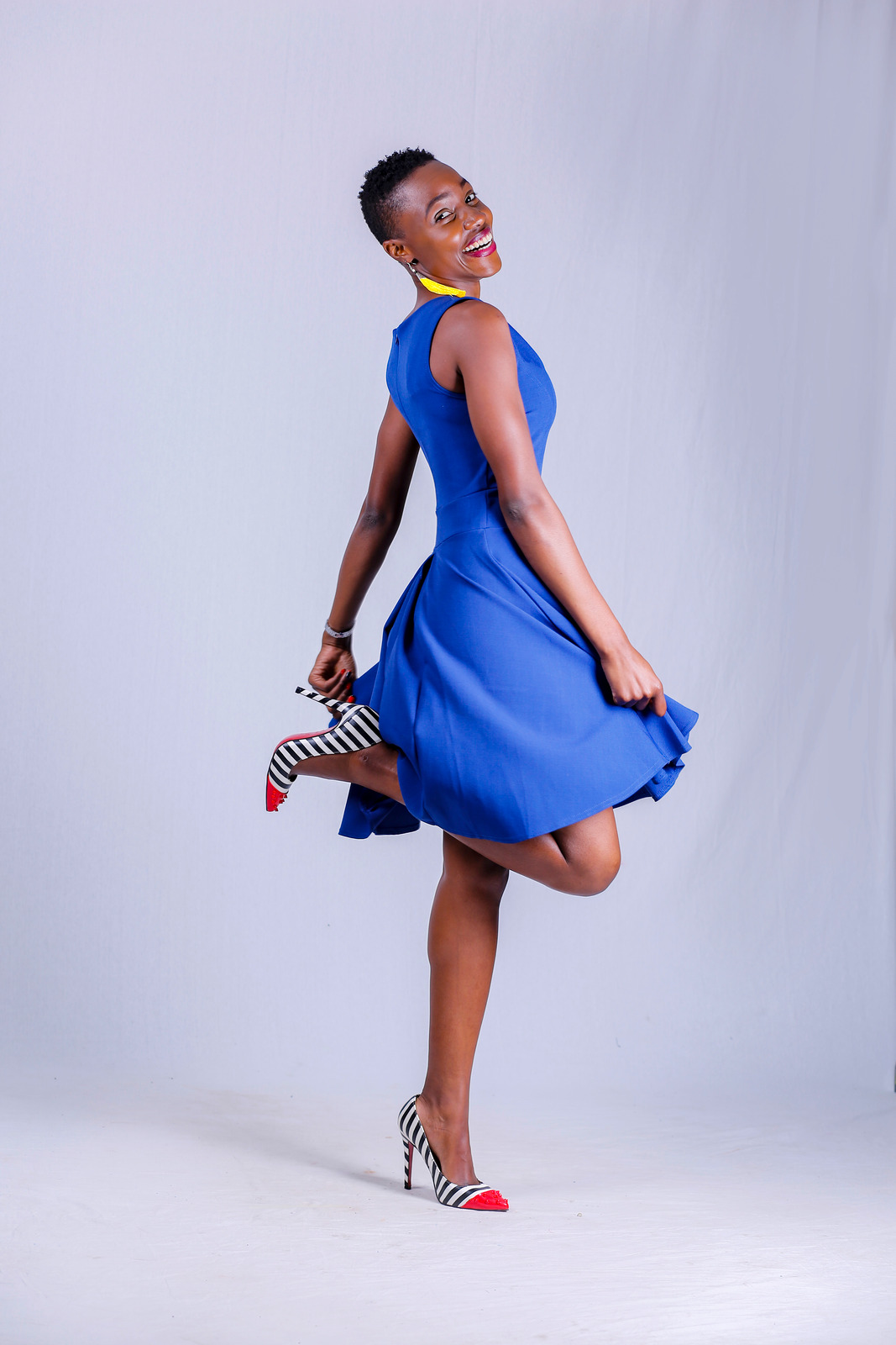 canva-woman-smiling-while-wearing-blue-dress-MADykvrUhM8